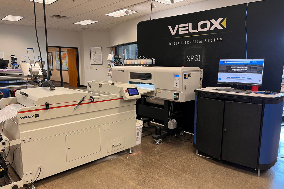 Velox DTF printer and powder shaker in the SPSI showroom